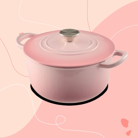 Aldi pink cast iron casserole dish on a pink background.