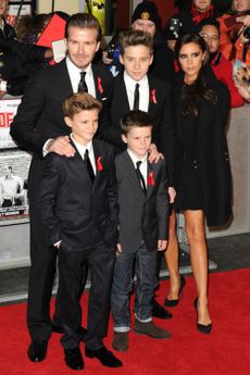 Victoria Beckham hits the red carpet with David and the boys