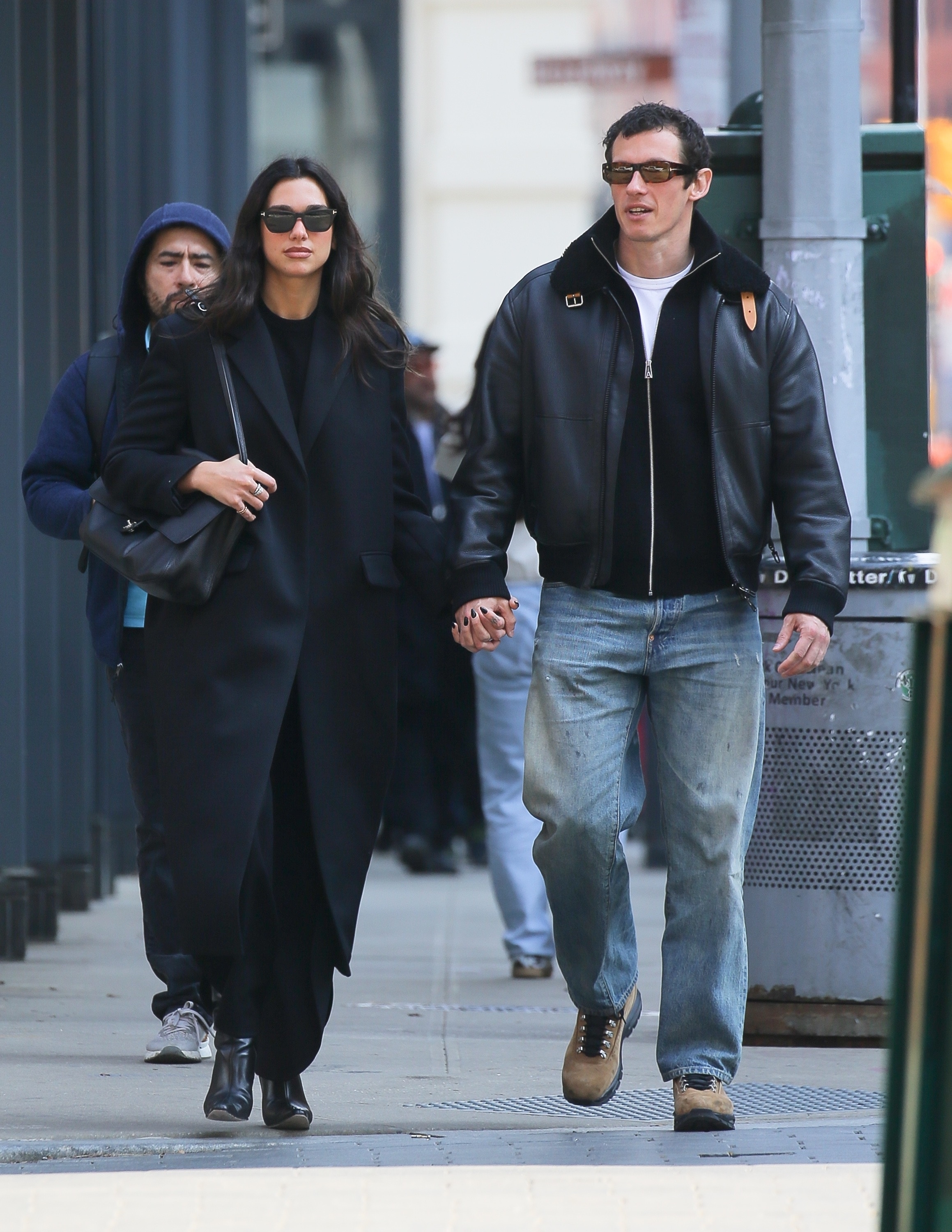 Dua Lipa livened up her all-black street style look with the Chanel maxi flap bag