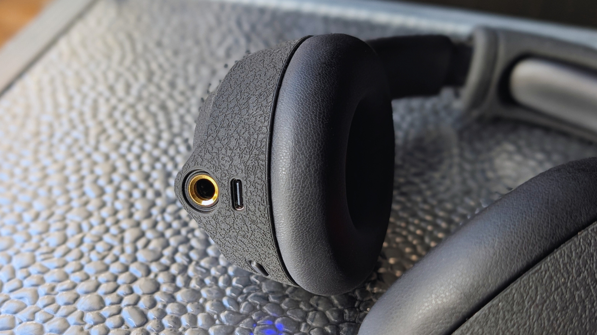 A close up of the input jack on the Positive Grid Spark Neo Core headphones