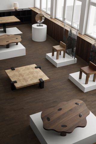 Walnut and birch veneer coffee tables and chunky chairs designed by Louise Liljencrantz