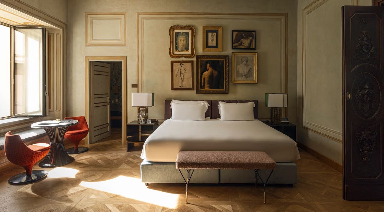 An old, renaissance-style palazzo is reinvented as a contemporary hotel, with plush furnishings and artefacts.