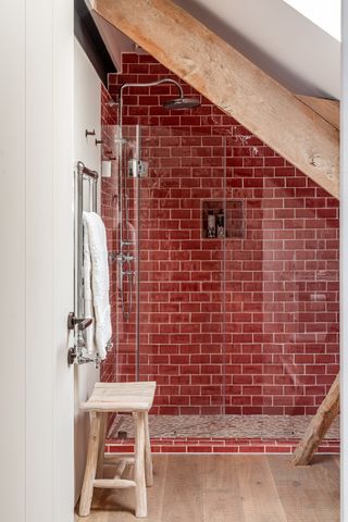 Shower room with red subway tiles