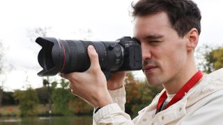 Canon RF 24-105mm f/2.8 IS USM Z lens on a Canon EOS R5 camera being used by a male photographer