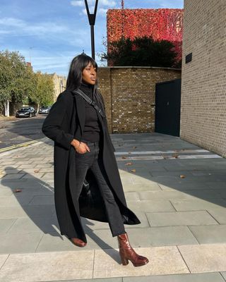 Georgia wears brown ankle boots with an all black look