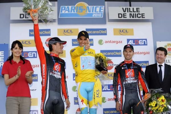 Luis Leon Sanchez and Alejandro Valverde stand back as Contador fires his pistol.