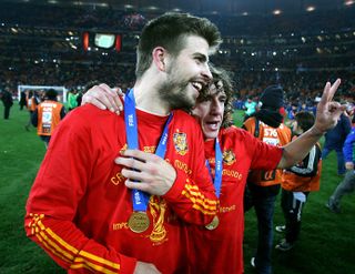 Spain's Gerard Pique and Carles Puyol celebrate after winning the 2010 World Cup