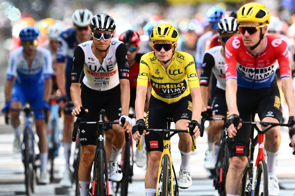 From L UAE Team Emirates Austrian rider Felix Grossschartner JumboVismas Danish rider Jonas Vingegaard wearing the overall leaders yellow jersey and JumboVismas Dutch rider Dylan Van Baarle cycle past the finish line of the 19th stage of the 110th edition of the Tour de France cycling race 173 km between MoiransenMontagne and Poligny in the Jura department of centraleastern France on July 21 2023 Photo by Marco BERTORELLO AFP Photo by MARCO BERTORELLOAFP via Getty Images