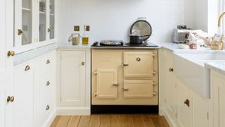 small cream Shaker kitchen with cream range cooker
