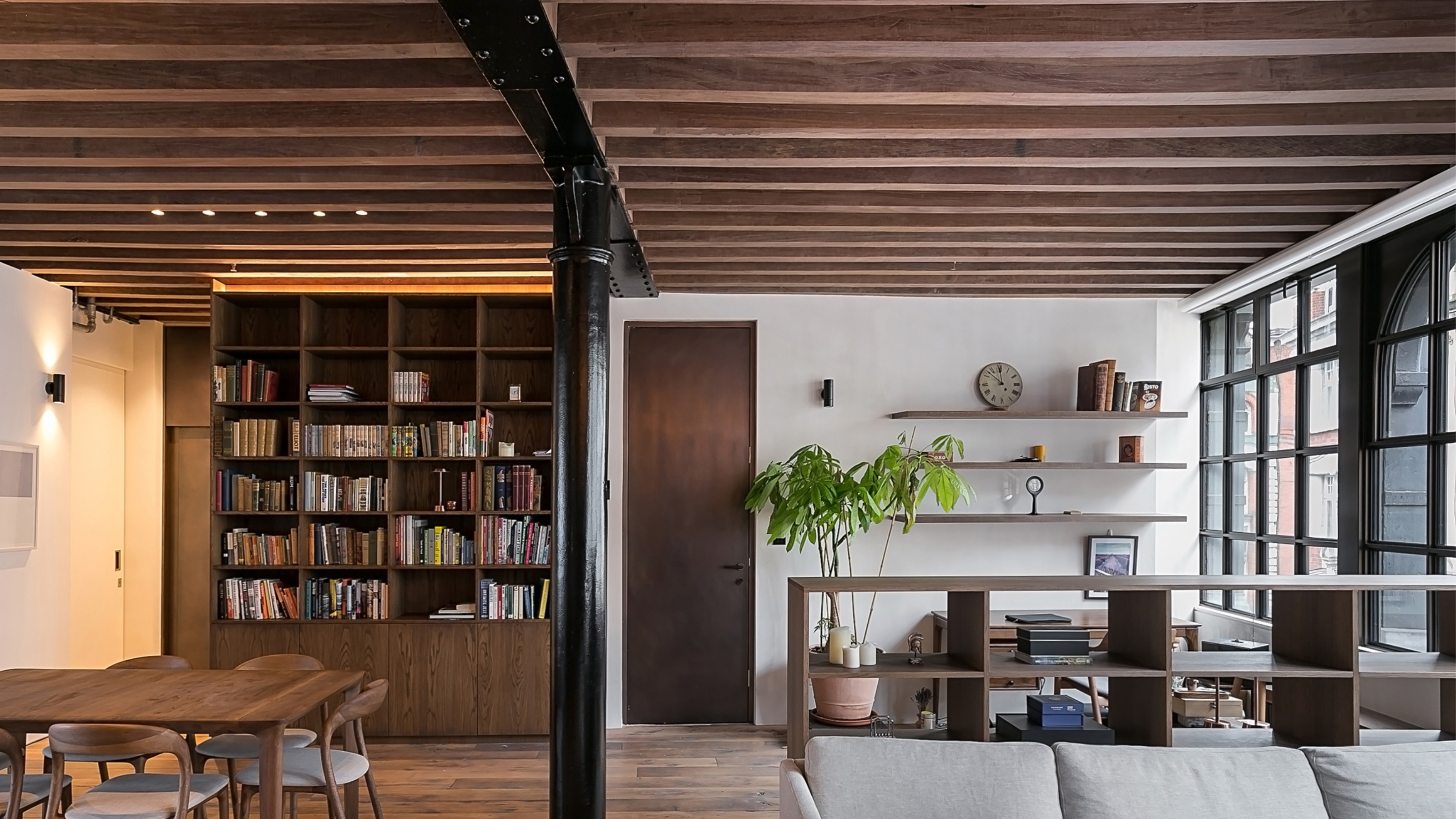 a modern loft apartment with wooden beam ceilings 