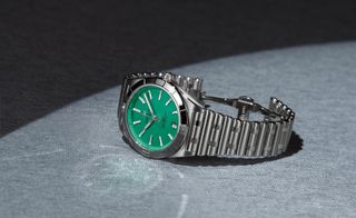 Green dial Victoria Beckham and Breitling watch with steel bracelet