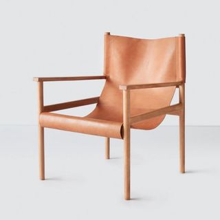 A brown leather chair for the best sustainable furniture brands.