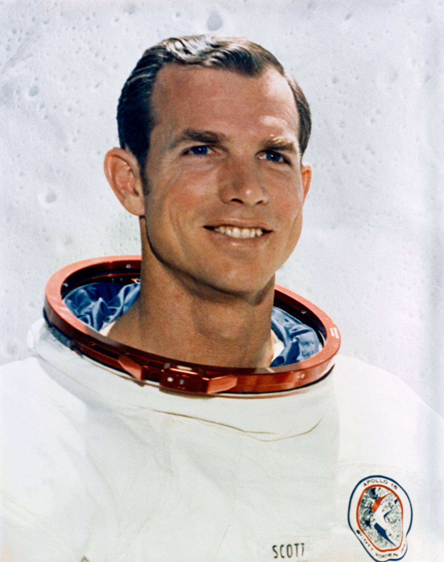 a man wearing a space suit smiles