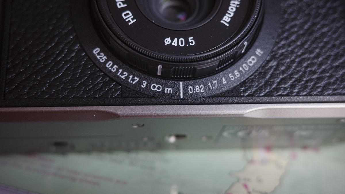Close up of the Pentax 17 compact film camera's focus distance indicator