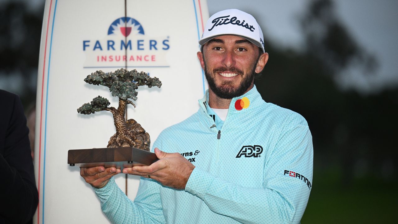 Max Homa poses with the trophy after his win at the 2023 Farmers Insurance Open