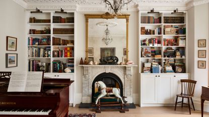 music room in a Victorian house with a rocking horse and grand piano