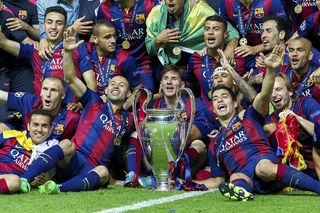 (L-R) Pedro Rodriguez of FC Barcelona, Jeremy Mathieu of FC Barcelona, Munir El Haddadi of FC Barcelona, Douglas of FC Barcelona, Javier Mascherano of FC Barcelona, Lionel Messi of FC Barcelona, Adriano of FC Barcelona with Champions League trophy during the UEFA Champions League final match between Barcelona and Juventus on June 6, 2015 at the Olympic stadium in Berlin, Germany.(Photo by VI Images via Getty Images)