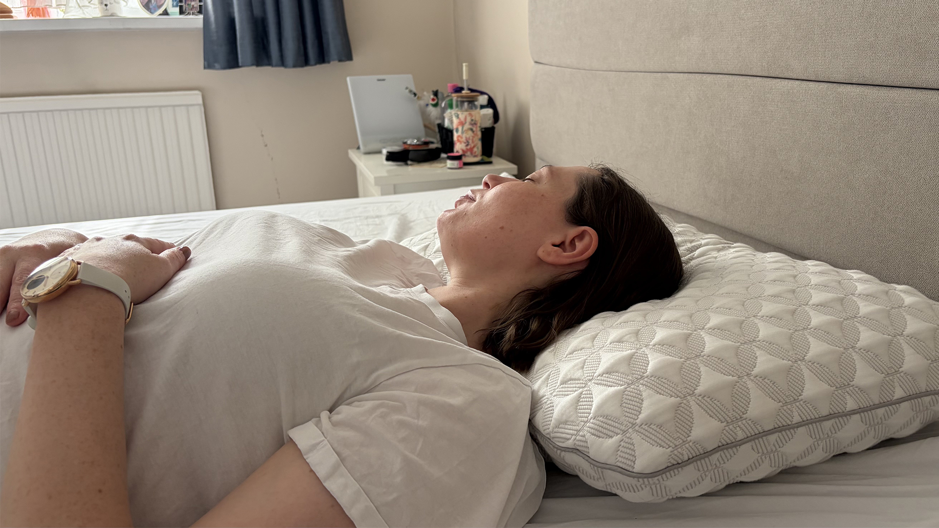 Sleep tester Ruth Jones lies on her back with her head on the Helix Talalay Latex pillow