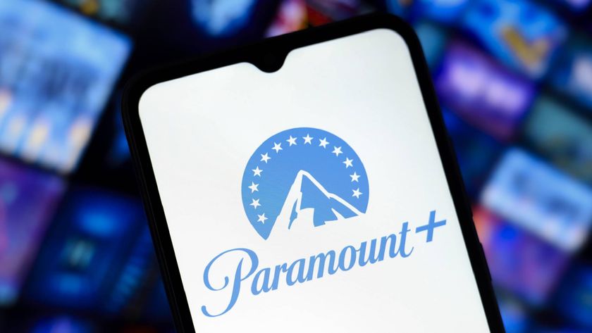 Paramount Plus logo on a smartphone screen with content library shown in the background. 