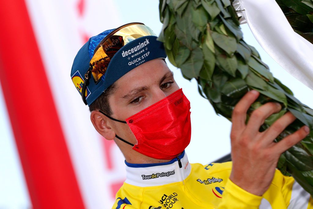 KRAKOW POLAND AUGUST 15 Joo Pedro Gonalves Almeida of Portugal and Team Deceuninck QuickStep Yellow Leader Jersey celebrates at Podium as final race winner during the 78th Tour de Pologne 2021 Stage 7 a 145km stage from Zabrze to Krakw TourdePologne TDP2021 UCIWT on August 15 2021 in Krakow Poland Photo by Bas CzerwinskiGetty Images
