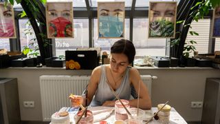 Artist working in her studio