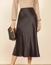 Reformation Petites Pratt Skirt | $178/£180
Oh-so-perfect for winter weddings, as it can be easily dressed up or down, this silk slip-style skirt is available in three colorways (we are loving the black/brown hue). Team with a roll-neck and some court shoes, top with a luxe trench or faux-fur coat and you're ready to go.