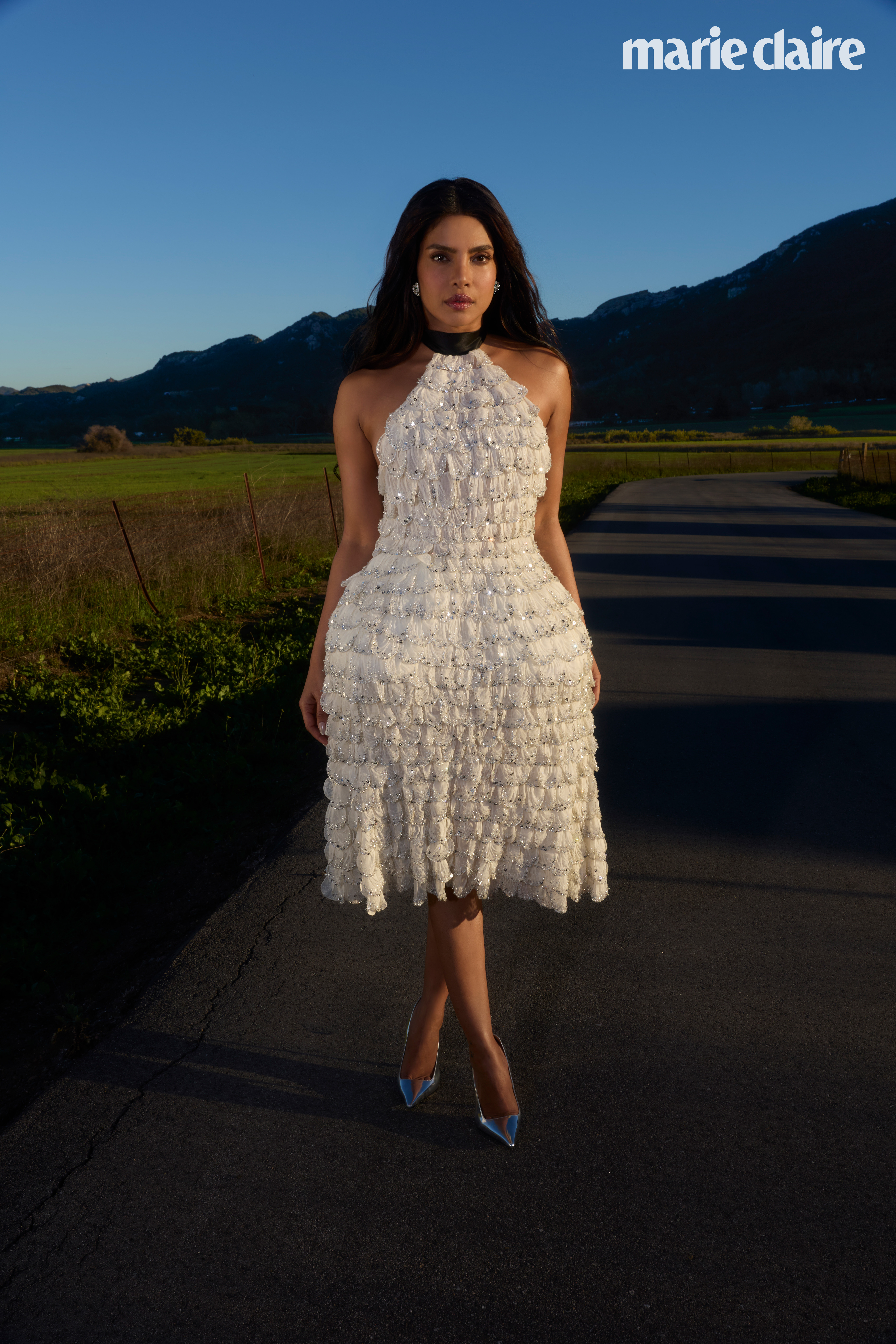 Priyanka Chopra Jonas wearing a white frilly dress