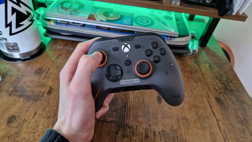 The Scuf Valor Pro being held by a reviewer