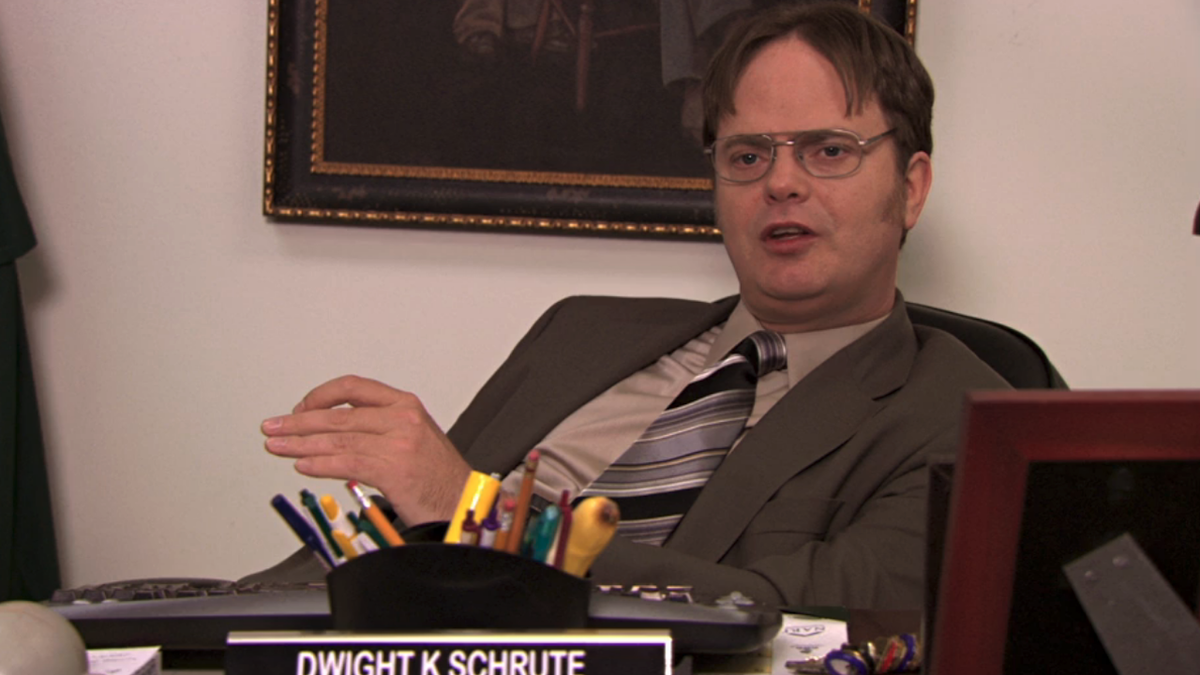 Rainn Wilson as Dwight Schrute talking while at his desk in The Office, Season 7, Episode 10 