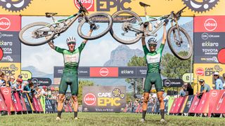 The mixed pair winning duo on the finish line of 2023 Cape Epic