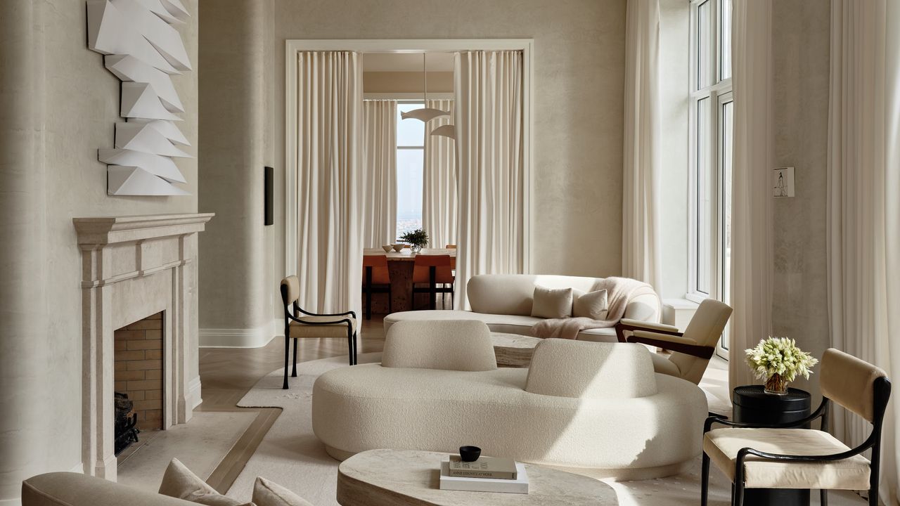 White living room with boucle conversation sofa and textured walls