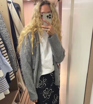 Olympia Gayot wearing a brushed cashmere cardigan, white tee, and floral-print skirt.