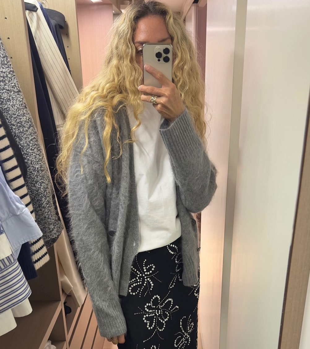 Olympia Gayot wearing a brushed cashmere cardigan, white tee, and floral-print skirt.