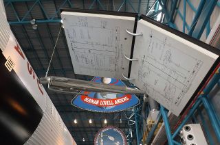 A large-than-life Fisher Space Pen and Apollo flight plan is now on display in the Apollo/Saturn V Center at the Kennedy Space Center Visitor Complex in Florida.