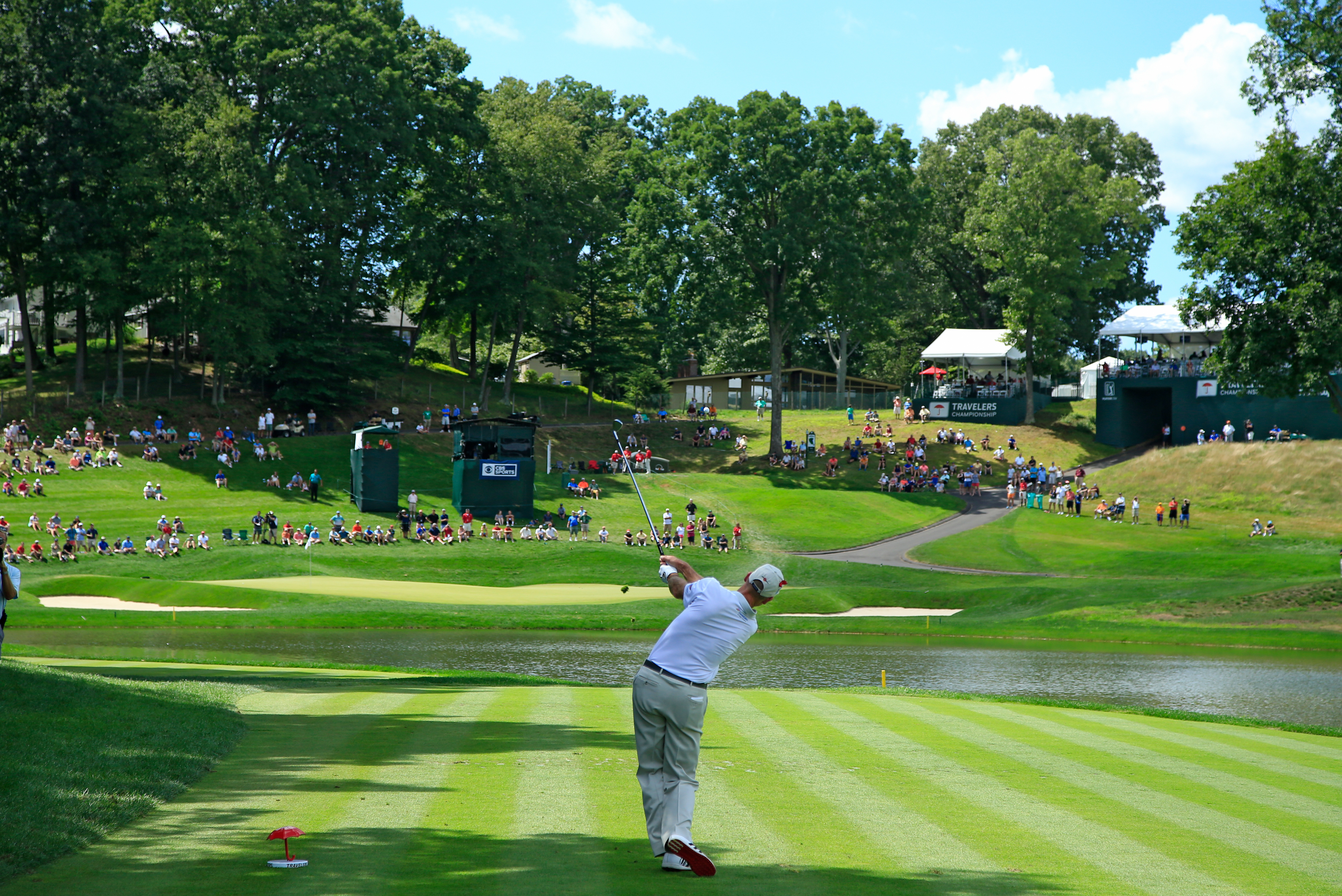Jim Furyk hits a golf shot at the par 3