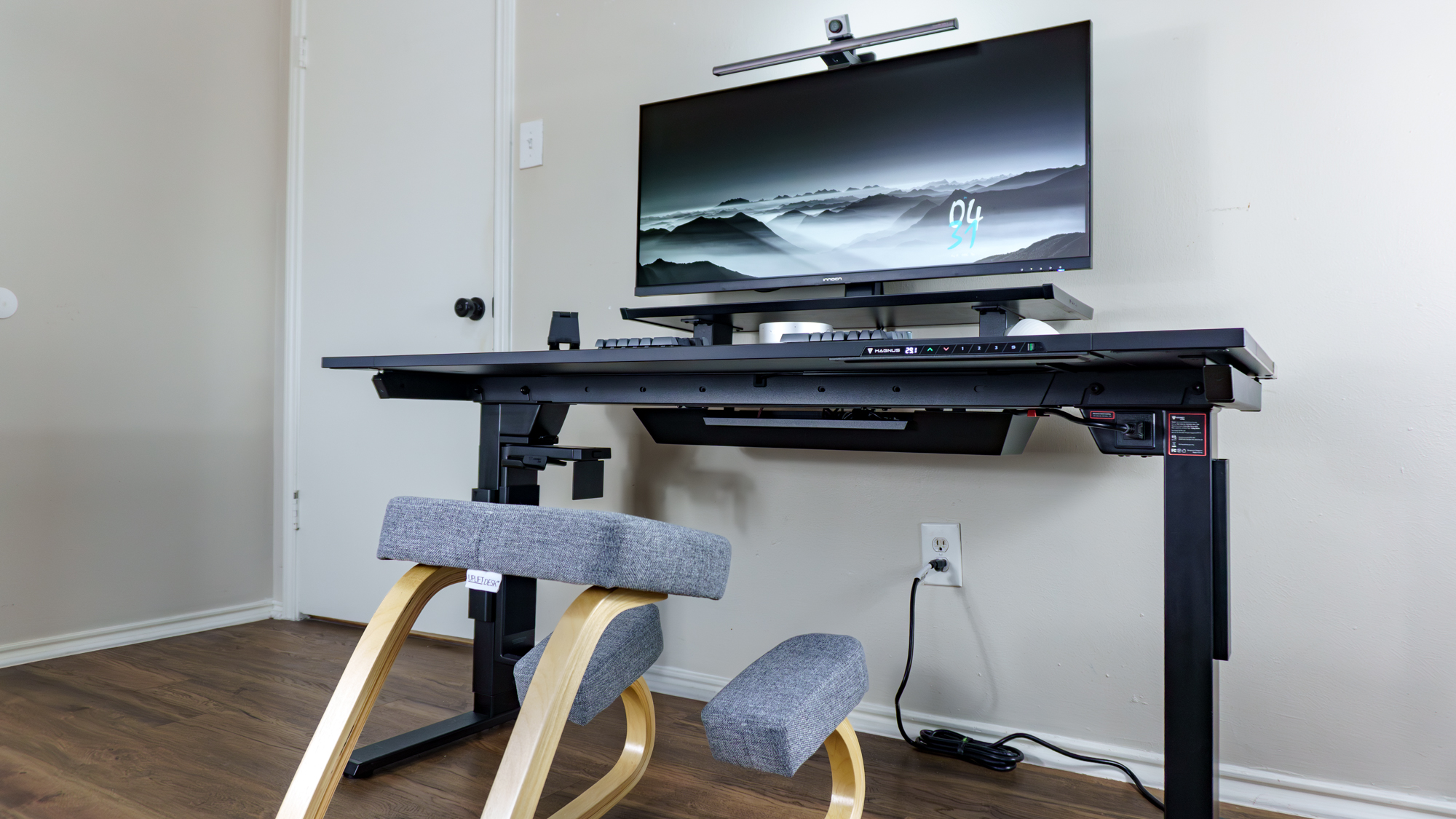 A kneeling chair in front of a desk