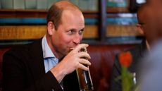 Prince William sips a pint in a pub