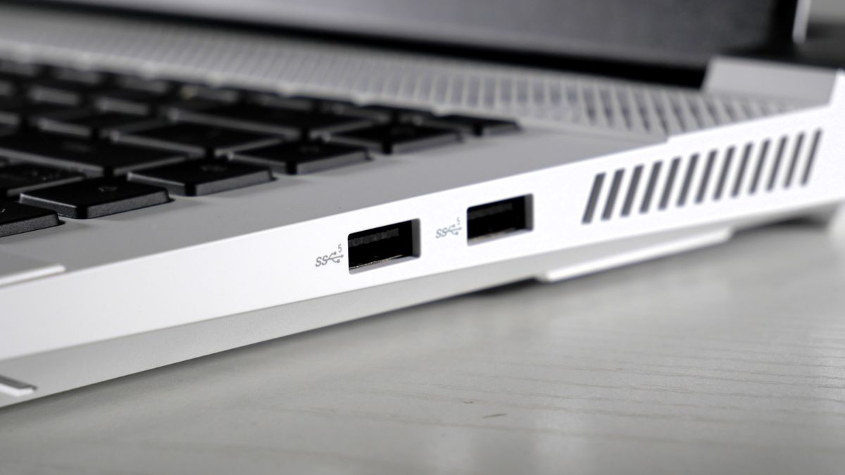 Dell G16 (7630) open on a white table, highlighting the ports on the right side, including two USB Type-A.
