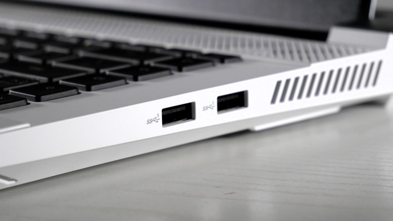 Dell G16 (7630) open on a white table, highlighting the ports on the right side, including two USB Type-A.