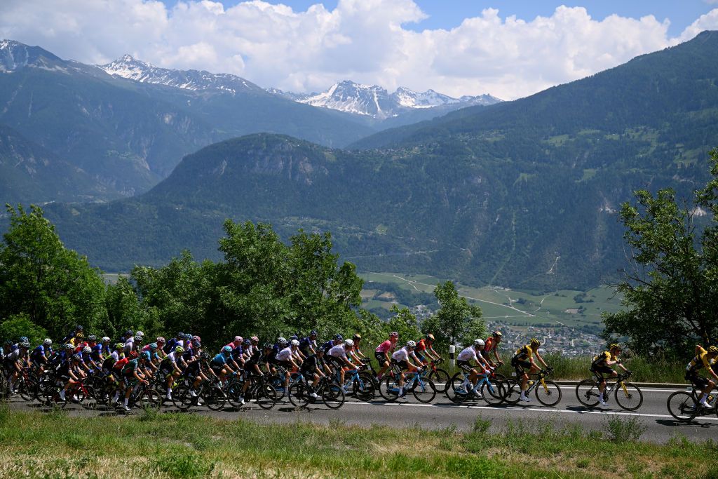LEUKERBAD SWITZERLAND JUNE 14 A general view of the peloton compete climbing to the CransMontana 1131m during the 86th Tour de Suisse 2023 Stage 4 a 1525km stage from Monthey to Leukerbad 1367m UCIWT on June 14 2023 in Leukerbad Switzerland Photo by Dario BelingheriGetty Images