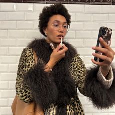 Influencer styles a leopard print coat.