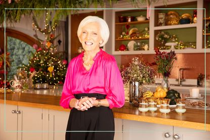 a still of Mary Berry in a kitchen with a christmas tree