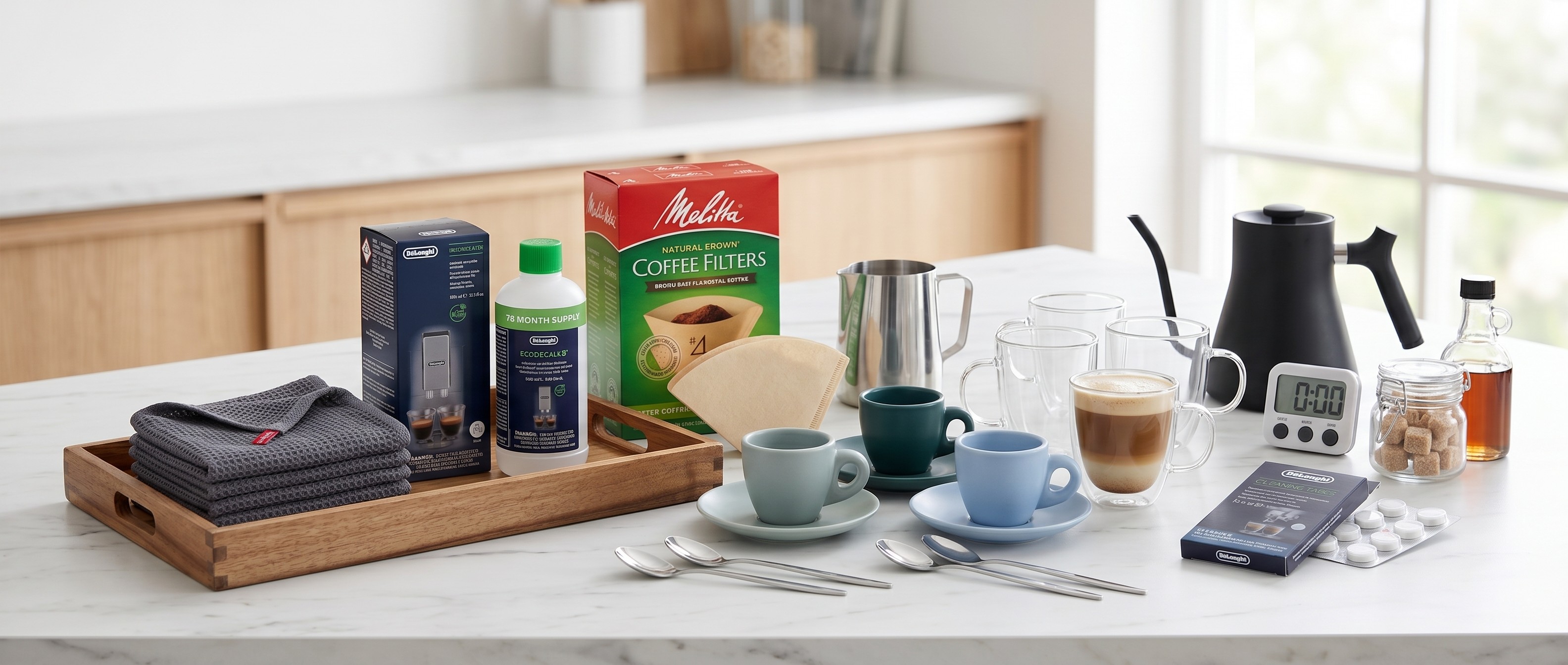 Collection of coffee-making accessories spread out on a marble countertop