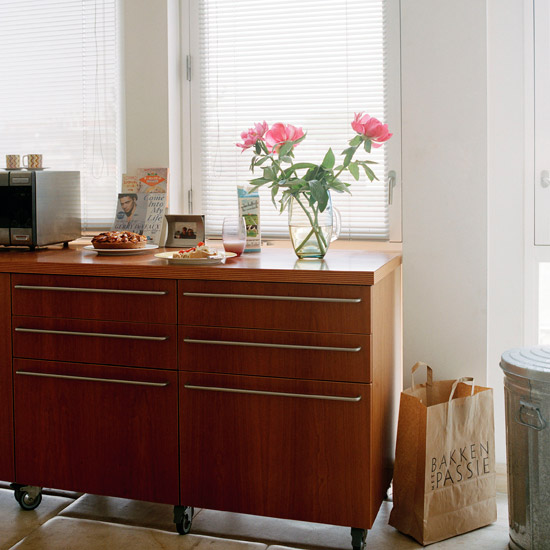 kitchen with wheel cabinet and glass window