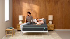 Couple lying down on mattress with emma sleep box