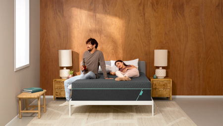 Couple lying down on mattress with emma sleep box