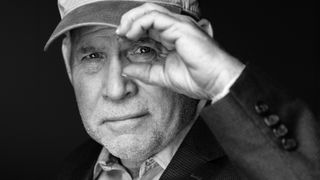 US photographer and photojournalist Steve McCurry poses during a photo session in Paris, on December 7, 2021. (Photo by JOEL SAGET / AFP) 