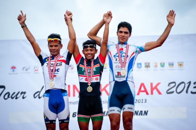 The podium for stage winner (L to R), second place Zamri Saleh (Terengganu Cycling Team), the winner Ronnel Hualda (Team 7 Eleven Presented by Roadbike Philippines) and third place Hossein Nateghi (Tabriz Petrochemical Cycling Team)