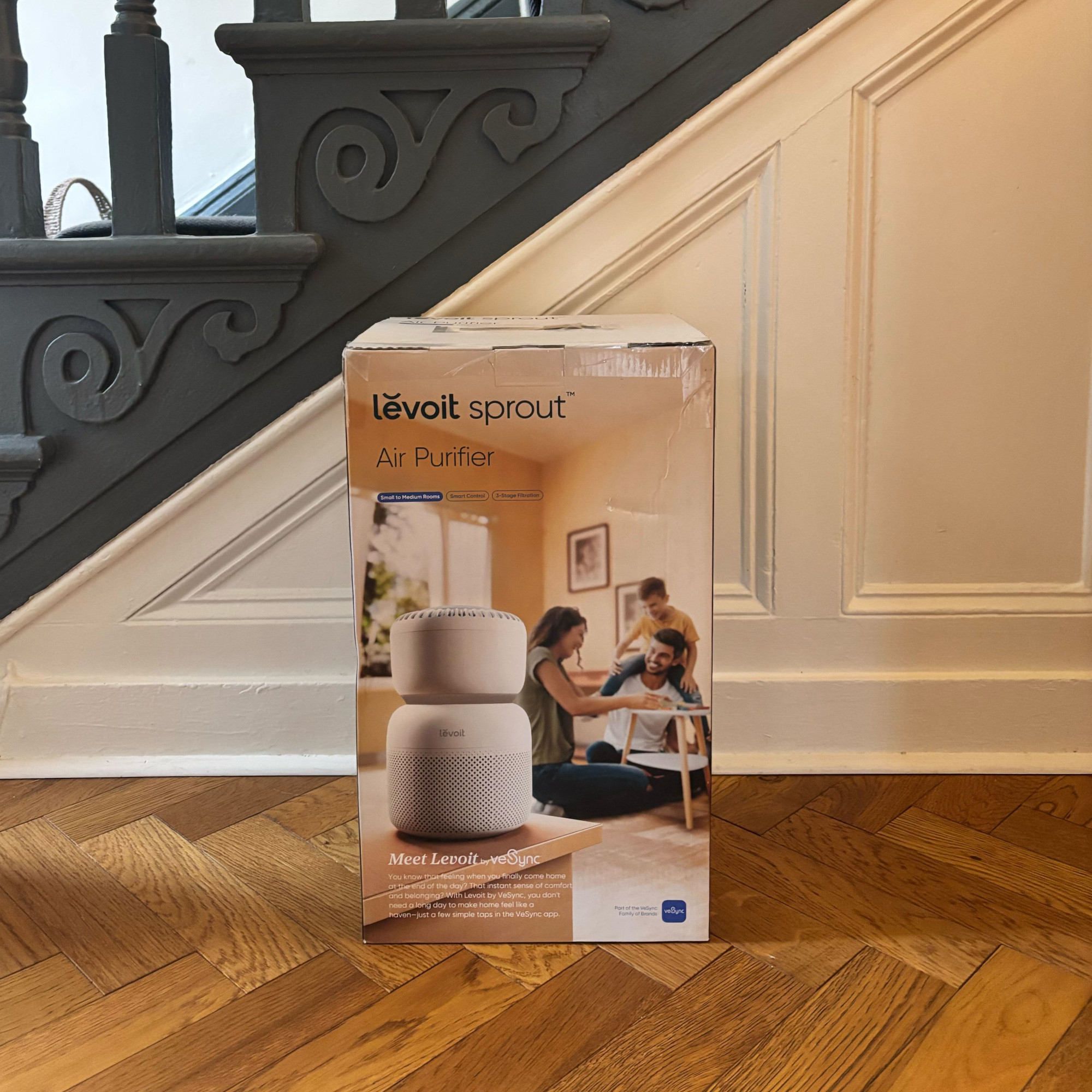 levoit sprout air purifier in a box in a hallway