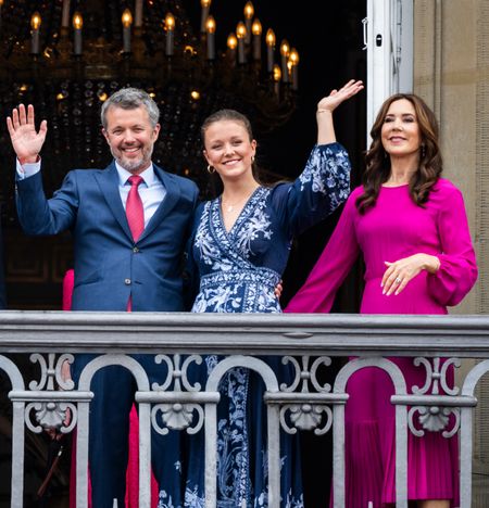 King Frederik, Queen Mary and Princess Isabella waving on a balcony in 2024